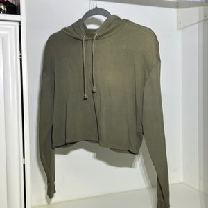 Sweater but is cropped, in small size.